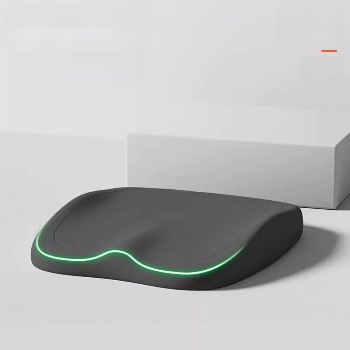 Cushion to prevent buttock pain, black contoured seat cushion with a smooth surface and glowing green edge