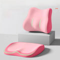 Cushion to prevent buttock pain in pink contoured memory foam, with a matching lumbar cushion and green accent piping