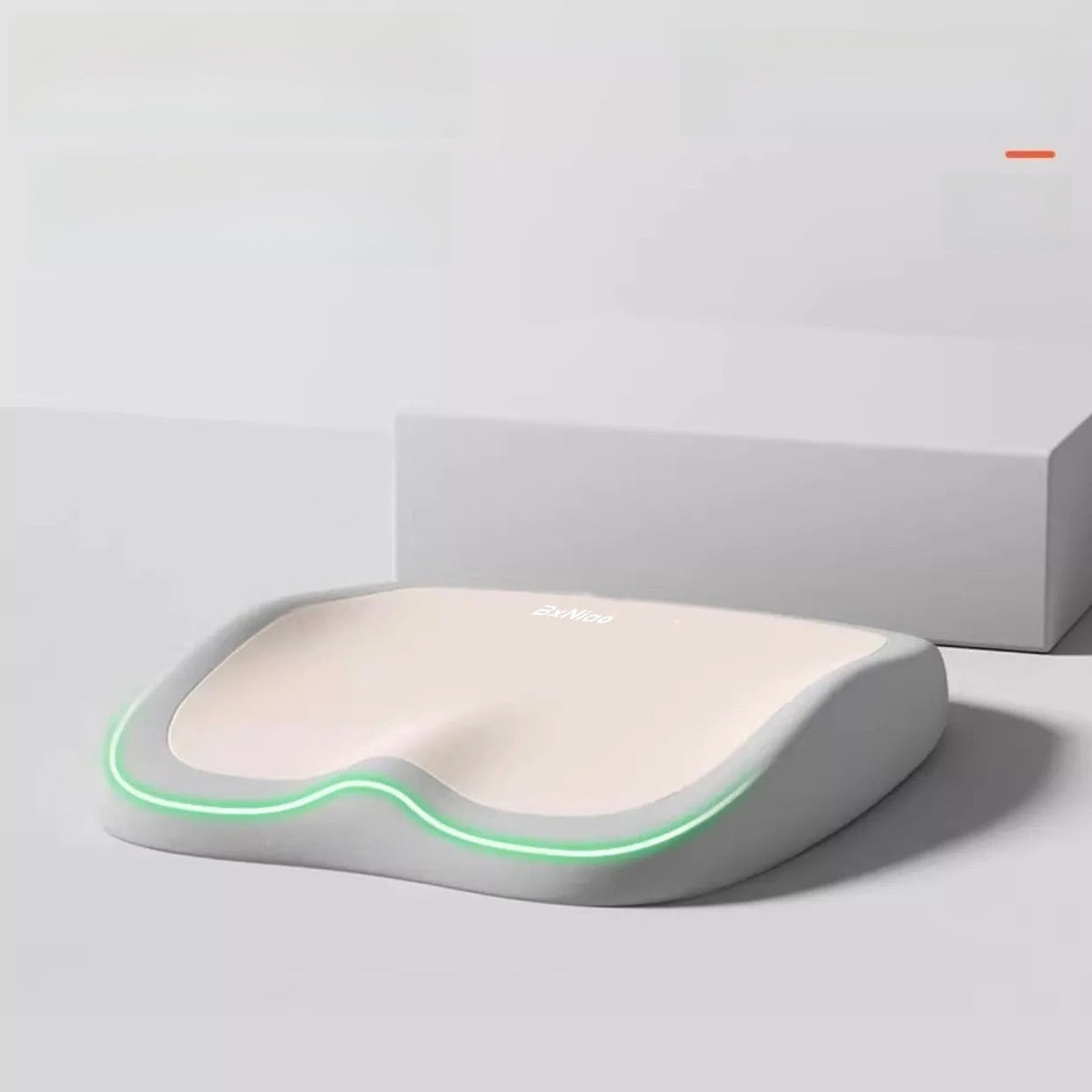Cushion to prevent buttock pain in white memory foam with a contoured seat shape and glowing green edge