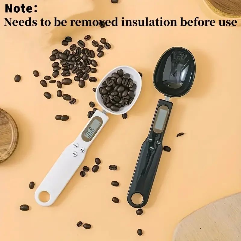 Digital Scale set of white and black plastic measuring spoons with LCD displays and detachable oval bowls for ingredients