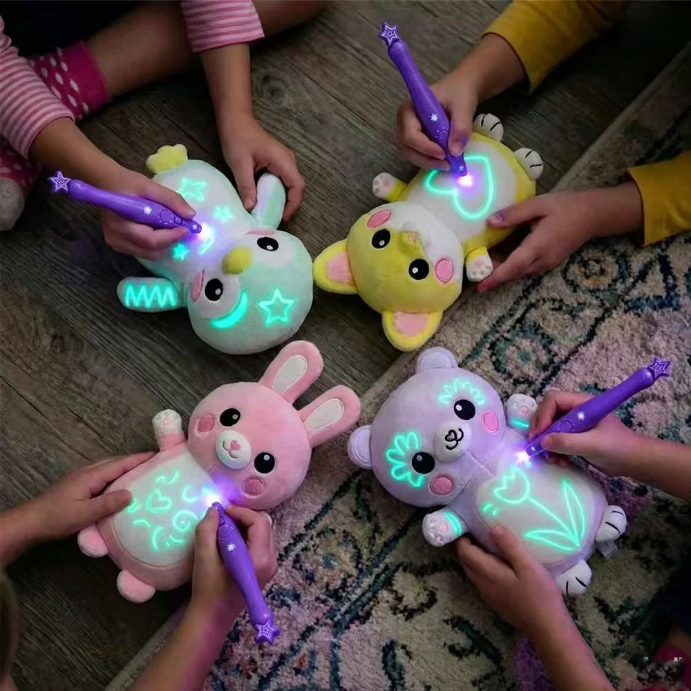 Drawing LED Light Up plush animal toys in mint, yellow, pink, and lavender, with glowing doodles and purple drawing pens
