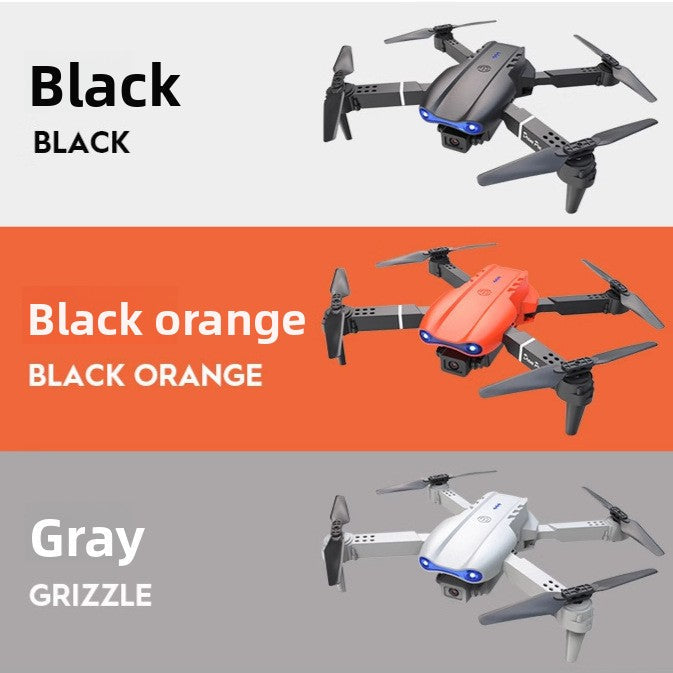 Drone 8K Aerial Photography quadcopter in black, orange, and gray plastic, with folding arms, four propellers, and front camera lens.