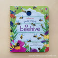 Children’s board book, Educational  Picture Books, with a green floral cover, buzzing bees, and peek-through hole to a beehive
