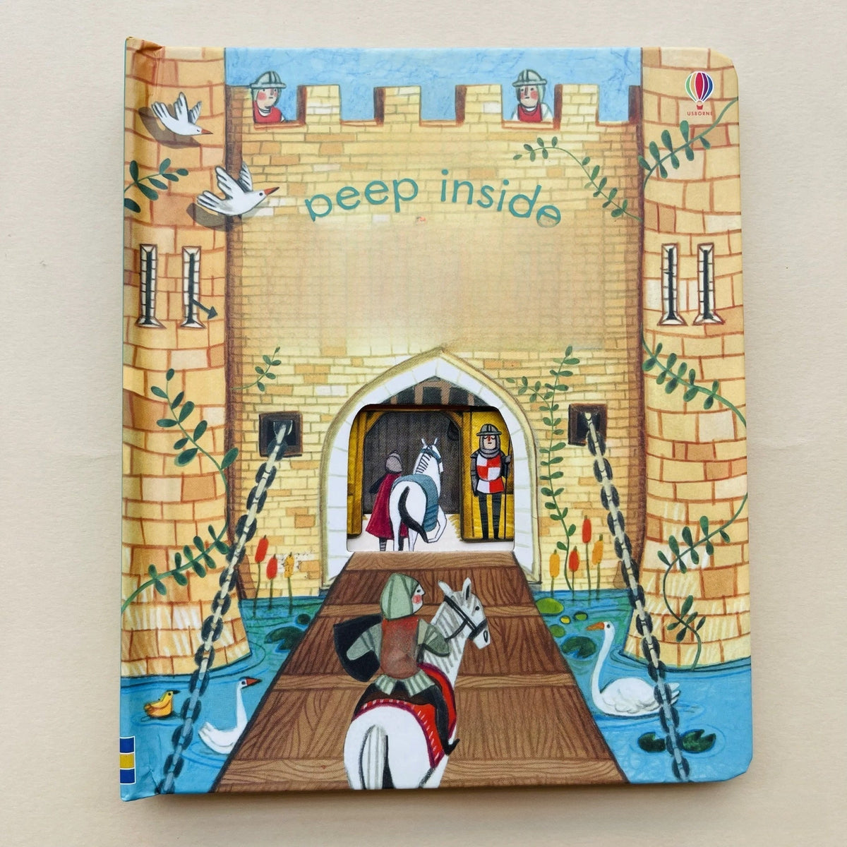 Toddler board book, a colorful illustrated castle with knights, a drawbridge, swans and peek-through details; Educational  Picture Books