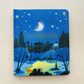 Educational  Picture Books peek-through board book with a blue nighttime cityscape cover, crescent moon cutout, stars, trees and park path.