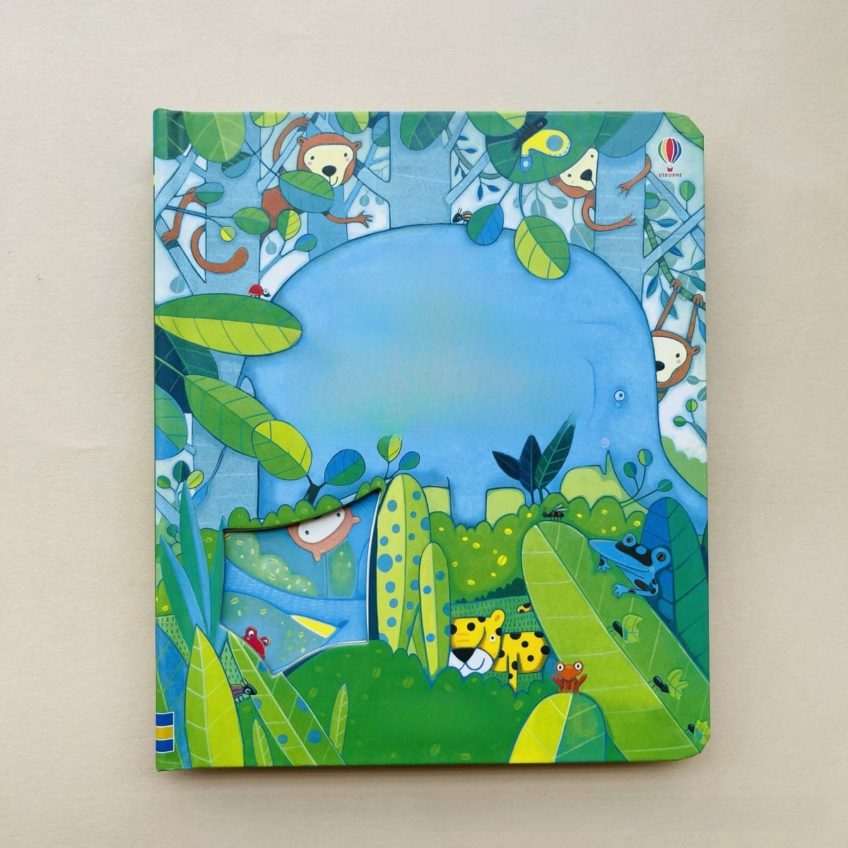 Board book featuring Educational  Picture Books, with a blue whale, colorful jungle animals and leafy green illustrations around a peek-through opening.