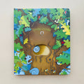 Educational  Picture Books peek-through board book with a colorful forest illustration, brown tree trunk, and a die-cut hole revealing an owl eye.