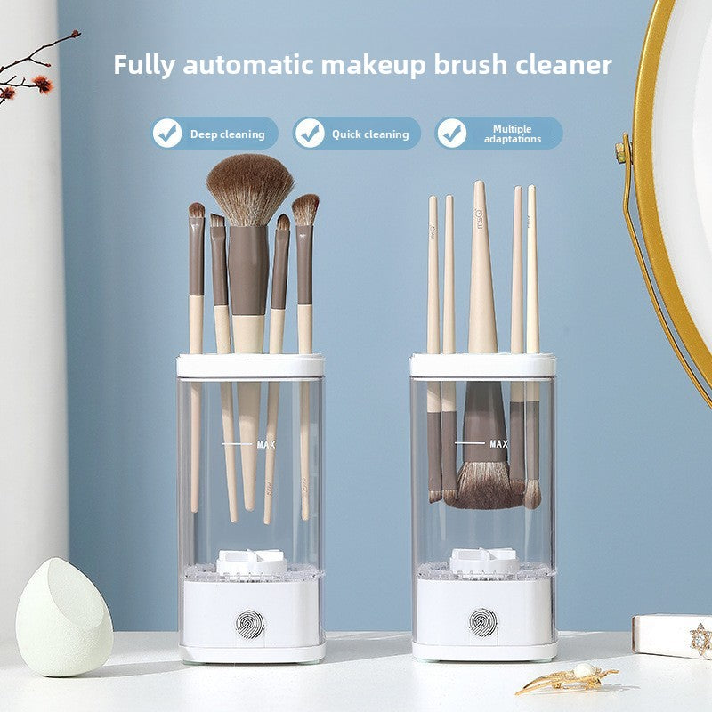Electric Makeup Brush Cleaner with clear cylindrical cup, white plastic base and lid, cleaning makeup brushes vertically inside
