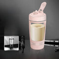 Electric Protein Shaker Cup in pale pink with a clear body, cream-colored drink, flip-top lid, and carry loop