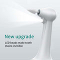 Electric Tooth Cleaner with a white ergonomic handle, narrow polishing tip and built-in LED light feature