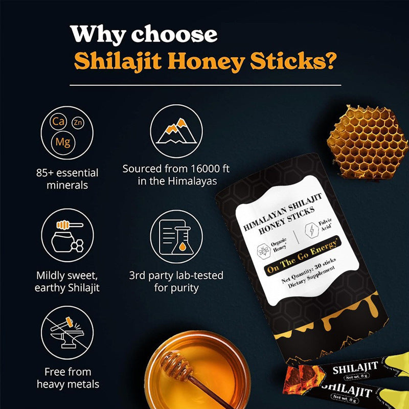 Energy Supplement honey sticks in a black and gold Shilajit Honey Sticks package with honeycomb pattern and honey dipper