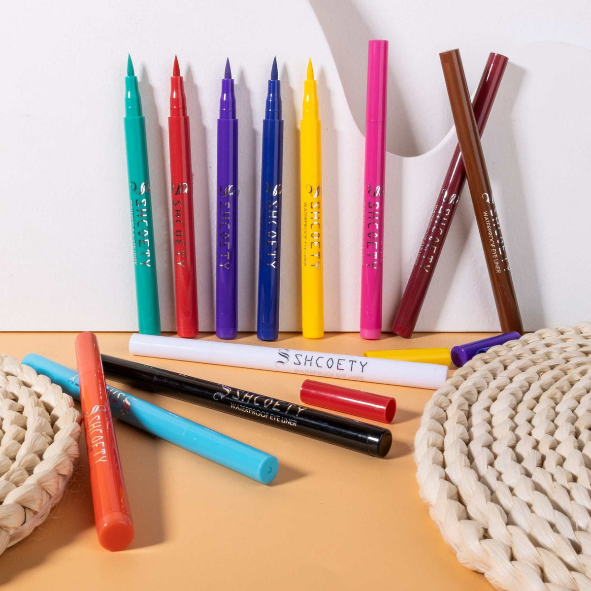 Eyeliner Pen Waterproof set of colorful matte plastic pens in turquoise, red, purple, blue, yellow, pink and brown with pointed tips