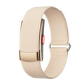 Fitness Monitor with a pale beige textured woven strap, gold-toned rectangular clasp, and slim dark tracker body