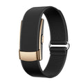 Fitness Monitor with a black textured woven band, gold-tone rectangular module, and adjustable metal loop clasp.
