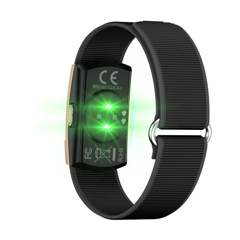 Fitness Monitor with a black woven fabric band and compact glossy rectangular sensor module with glowing green lights