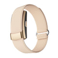 Fitness Monitor with a pale peach woven strap, gold-tone clasp and slim black sensor module in a loop design