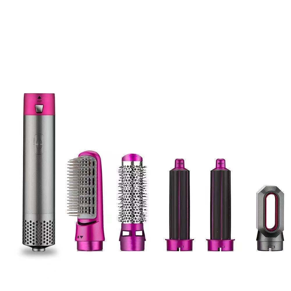 Five-in-One Hot Air Comb styling tool with silver and magenta finish, featuring five interchangeable brush and curling attachments.