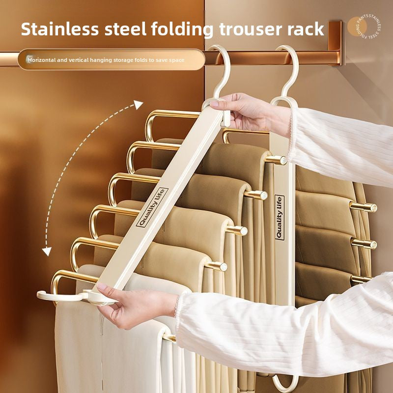 Folding Pants Rack with cream TPE-coated metal arms, tiered non-slip trouser bars, and a foldable design