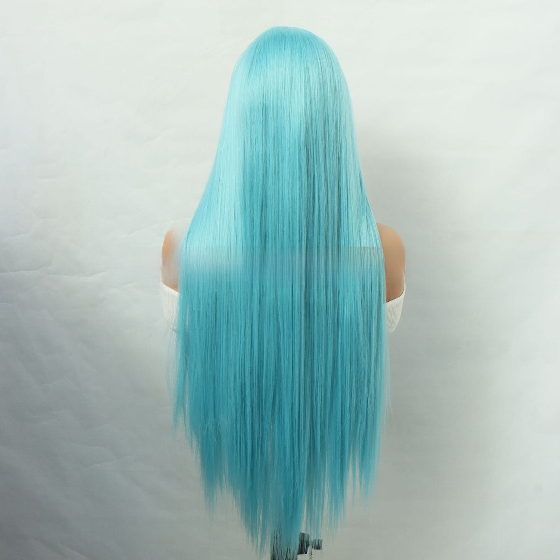 Front Lace Hand Knotted Wig in bright turquoise synthetic fiber, with long straight hair and a natural-looking lace hairline.