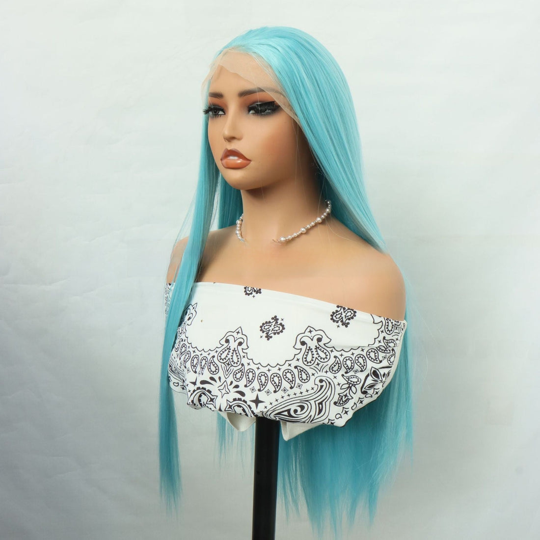 Front Lace Hand Knotted Wig in bright turquoise synthetic fiber, with long straight hair and a natural-looking lace hairline.