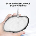 Glass Frosted Exfoliator with a smooth white frosted surface and dark rounded rim, held under running water