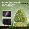 Hair Strengthening Soap in speckled olive-green herbal bars, one rounded and embossed with a circular character