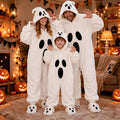 Halloween Ghost Plush Pajamas in soft white fleece, featuring hooded ghost faces and bold black oval accents for adults and child