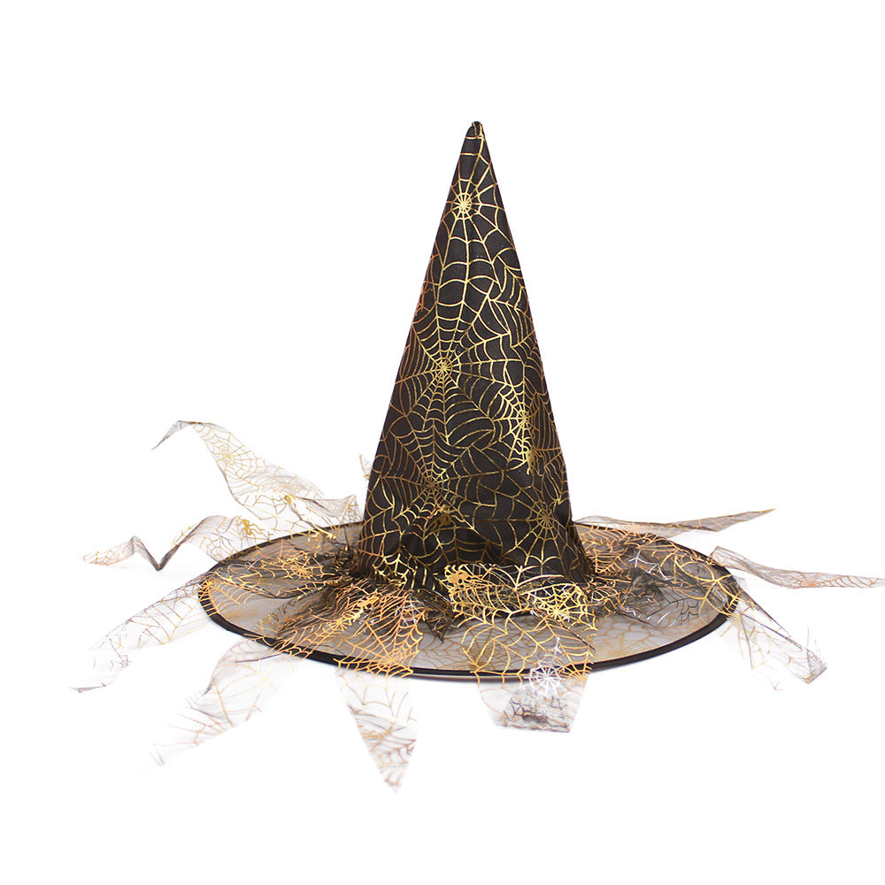 Halloween Hat in black fabric with gold spiderweb pattern, pointed crown and wide brim edged with trailing mesh