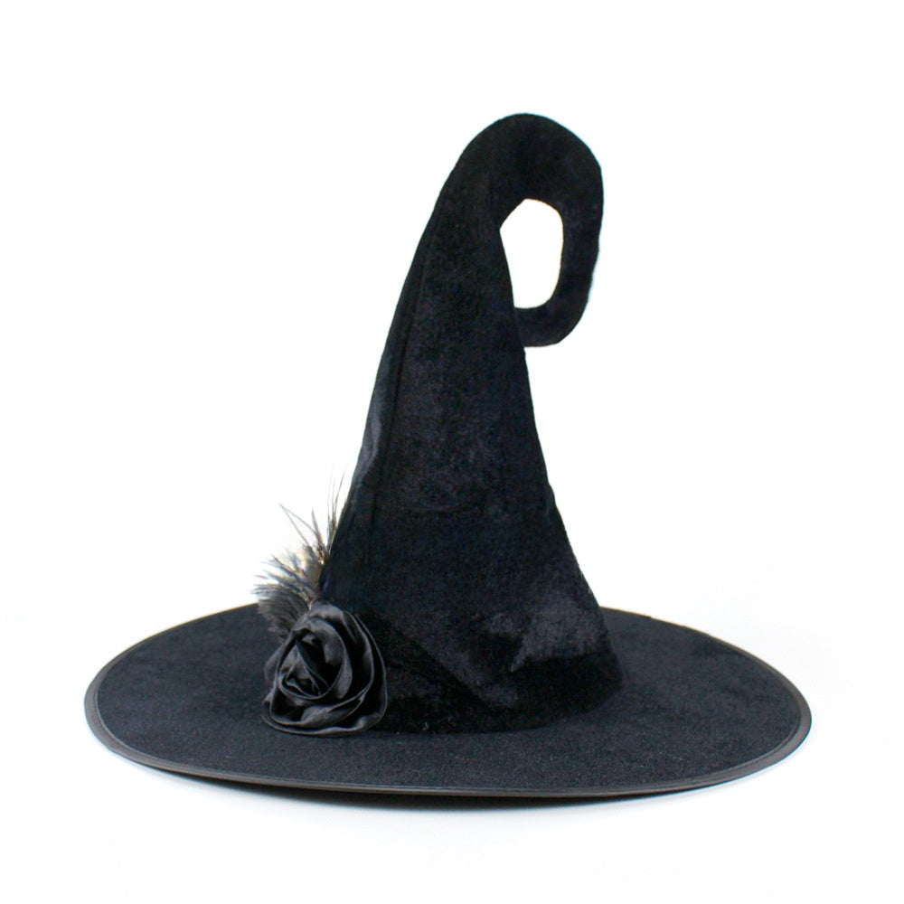 Halloween Hat in black velvet with a curled pointed crown, wide brim, and decorative black fabric rose with feather trim