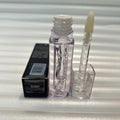 Huda Beauty Moisturizing lip gloss in a clear tube with a transparent applicator and glossy finish