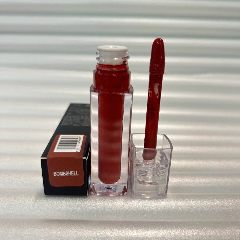Huda Beauty Moisturizing lip gloss in a clear rectangular tube with deep red color and matching applicator