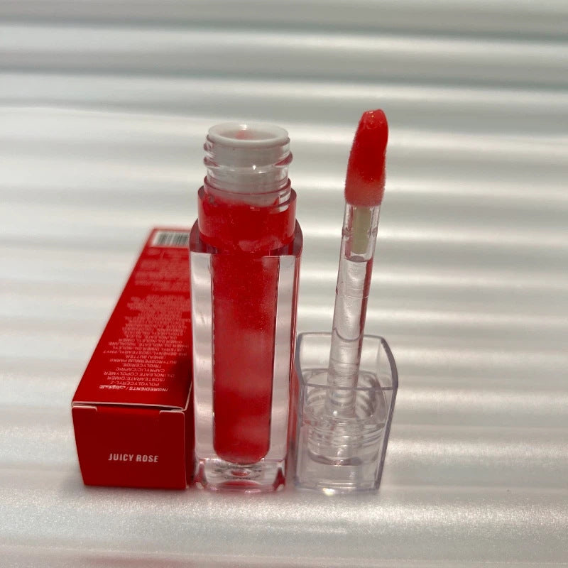 Huda Beauty Moisturizing lip gloss in vivid red, shown in a clear tube with a matching doe-foot applicator