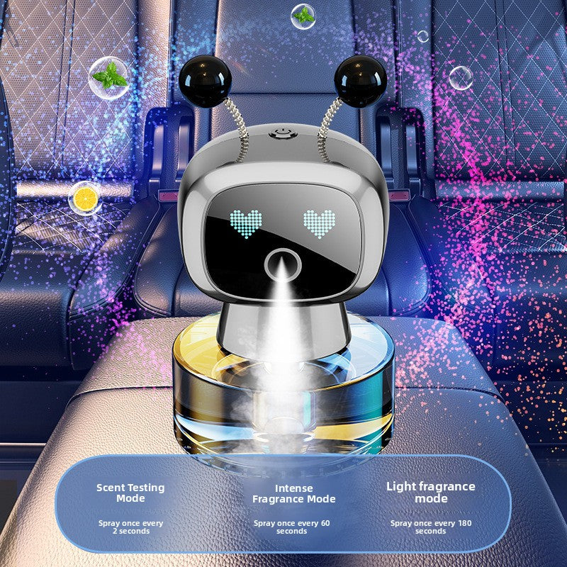 Intelligent Robot Car Fragrance Diffuser in glossy black and silver plastic, with antennae and a heart-shaped LED face emitting mist.
