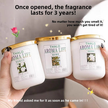 Solid fragrance air freshener jars with white bodies and gold lids, labeled in green with floral jasmine imagery; Jasmine Fragrance Air Fresh.