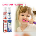 Kids Foam Toothpaste in red and blue pump bottles with matching cartons, fruit graphics and fluoride labels beside a child brushing her teeth
