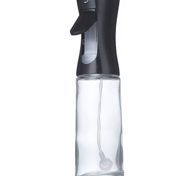 Kitchen Oil Spray Bottle with a clear glass body, black press trigger top and visible internal spray tube