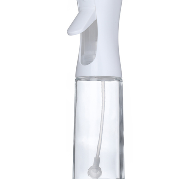 Kitchen Oil Spray Bottle with a clear glass reservoir, white plastic pump top, and visible internal spray tube