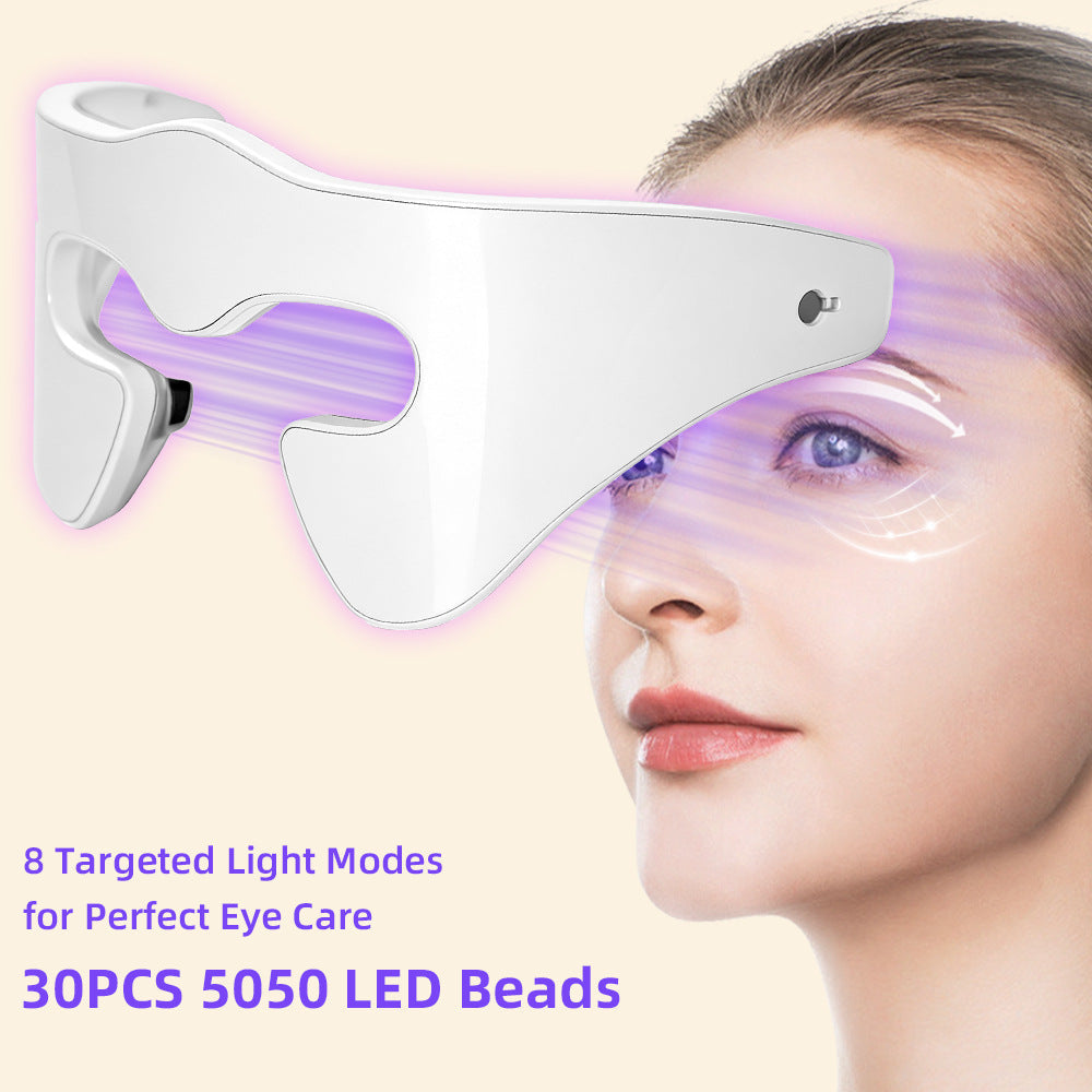 Eye massager with LED Red Blue Light, white curved shell, black display and glowing red light panels over the eyes