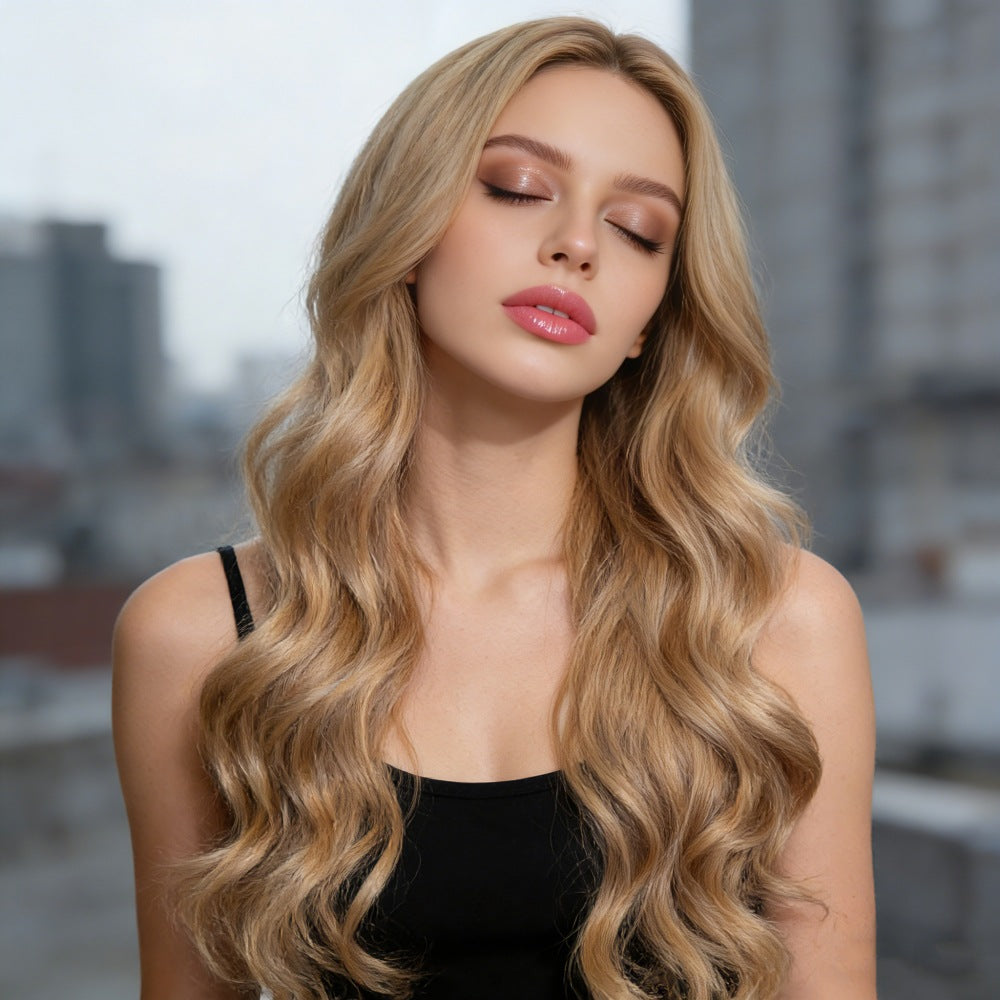 Long Curly Synthetic Wigs in honey blonde, featuring a center part and long, voluminous loose waves with a natural-looking texture.