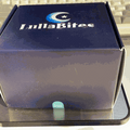 Lulla Bites Sleep Gummies box in dark navy and gray, featuring a crescent moon and star logo with white lettering