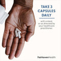 Men's Fertility Supplement with white soft capsules in an open hand and directions to take three capsules daily