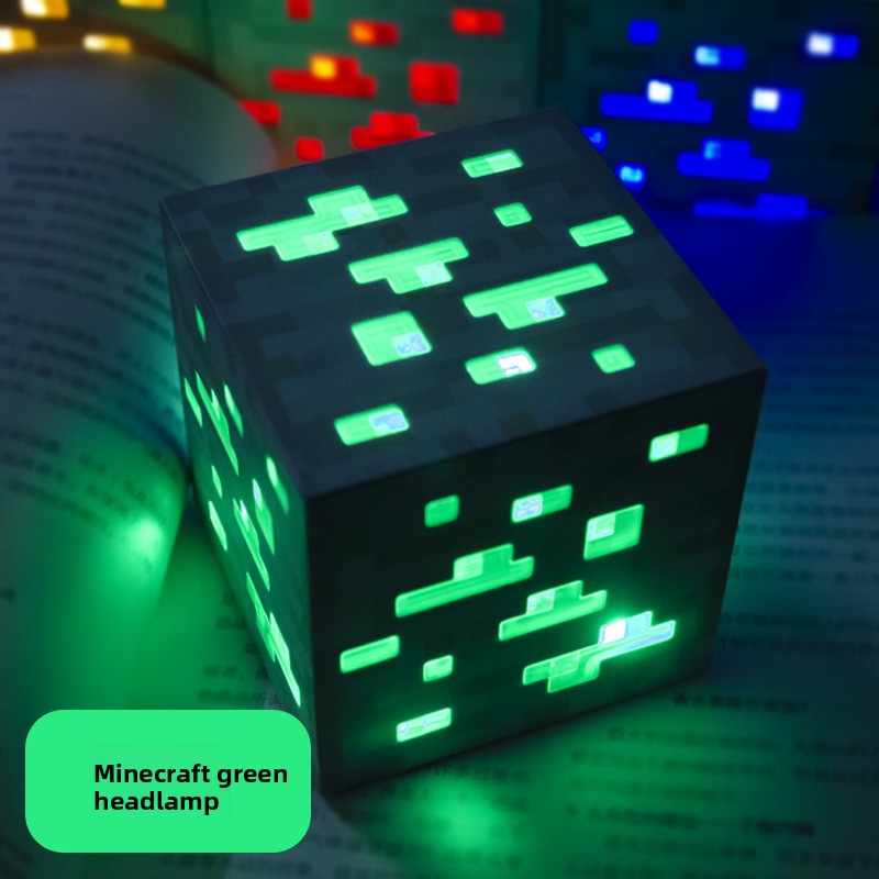 Minecraft Ore lamps cube lamp with a dark pixelated surface and bright green glowing ore shapes on each visible side