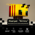 Minecraft Ore lamps featuring a glowing yellow pixel bee lamp with black square eyes, wings, and brown feet