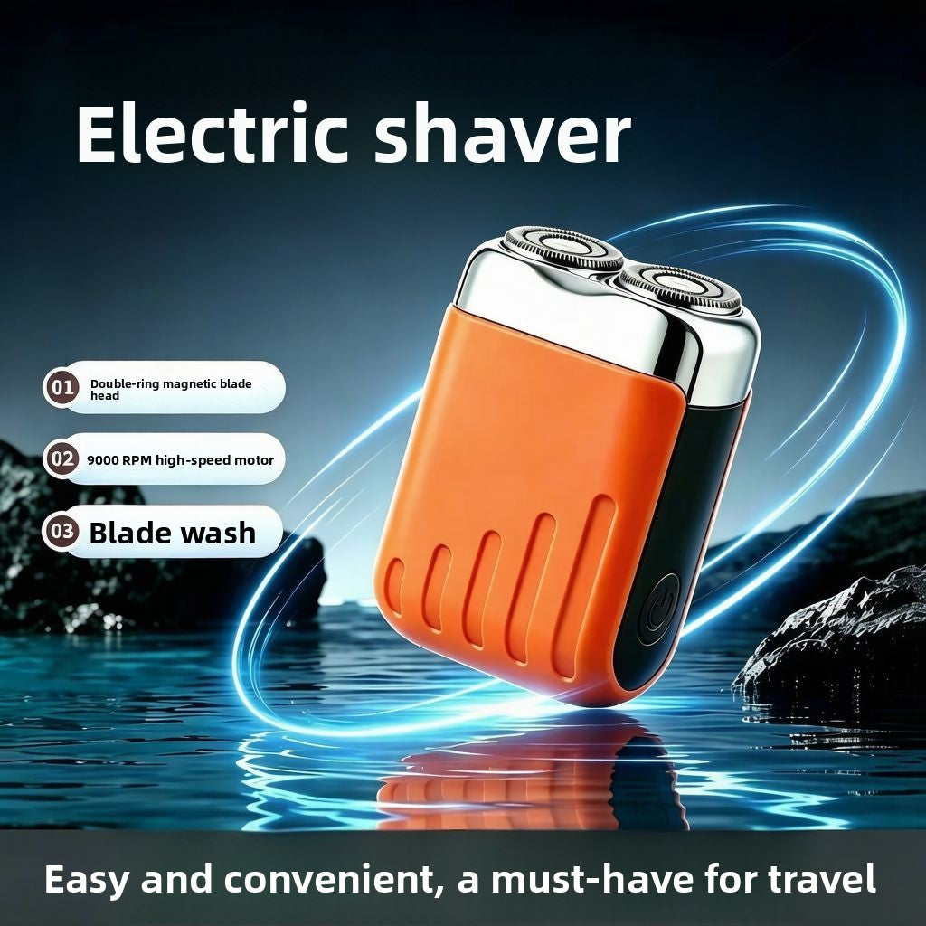 Mini Double Head Electric Shaver with an orange textured body, black side panel, and silver twin rotary heads.