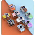 Miniature Digital Camera in colourful ABS plastic, with a retro compact body, prominent circular lens and small flip screen.