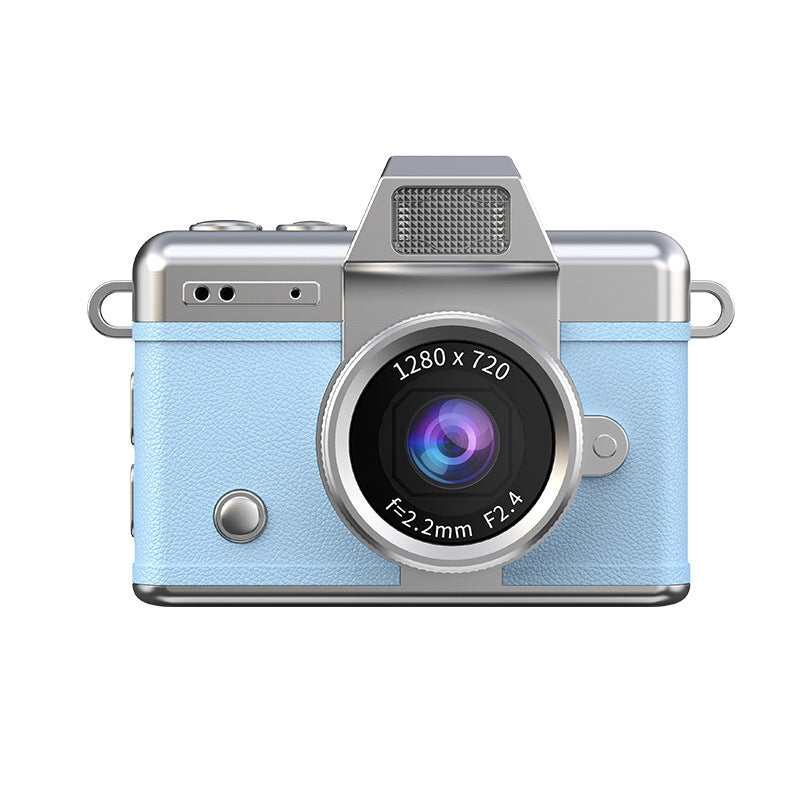 Miniature Digital Camera with a light blue textured body, silver trim and a prominent central lens in a retro design