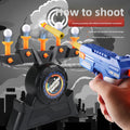 Moving Target Tabletop Game with black plastic base, floating white balls, orange launchers and blue toy gun.