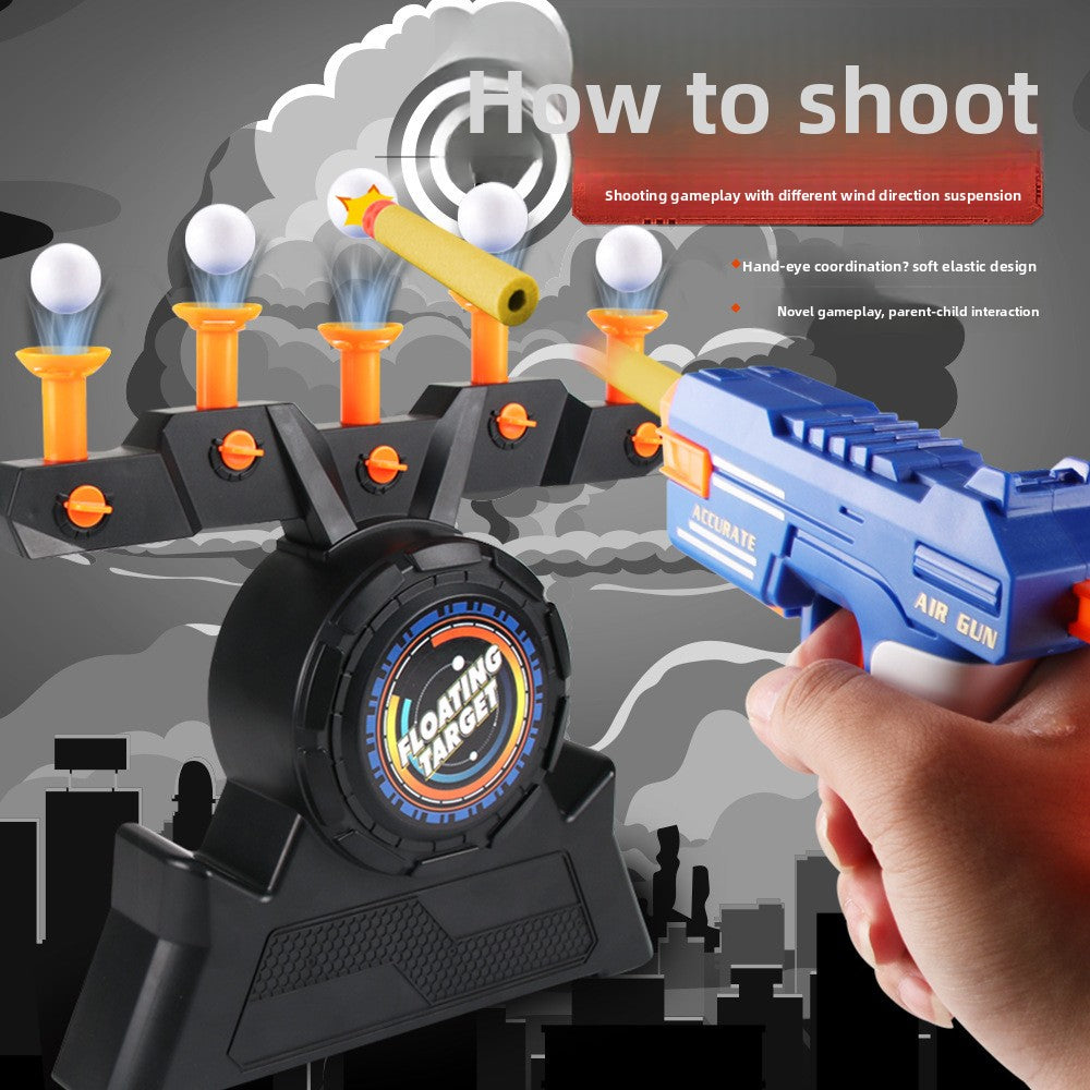 Moving Target Tabletop Game with black plastic base, floating white balls, orange launchers and blue toy gun.