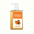 Persimmon Shower Gel in a clear amber pump bottle with an orange persimmon shampoo label and fruit illustration