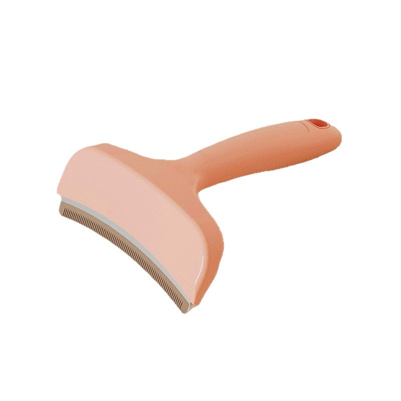 Pet Hair Removal Brush with a salmon pink plastic handle, pale rose angled head and fine metal grooming teeth